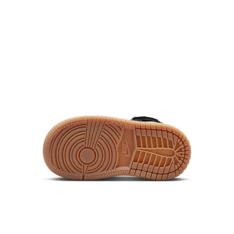 Toddler sneaker outsole view with tan gum rubber and textured traction