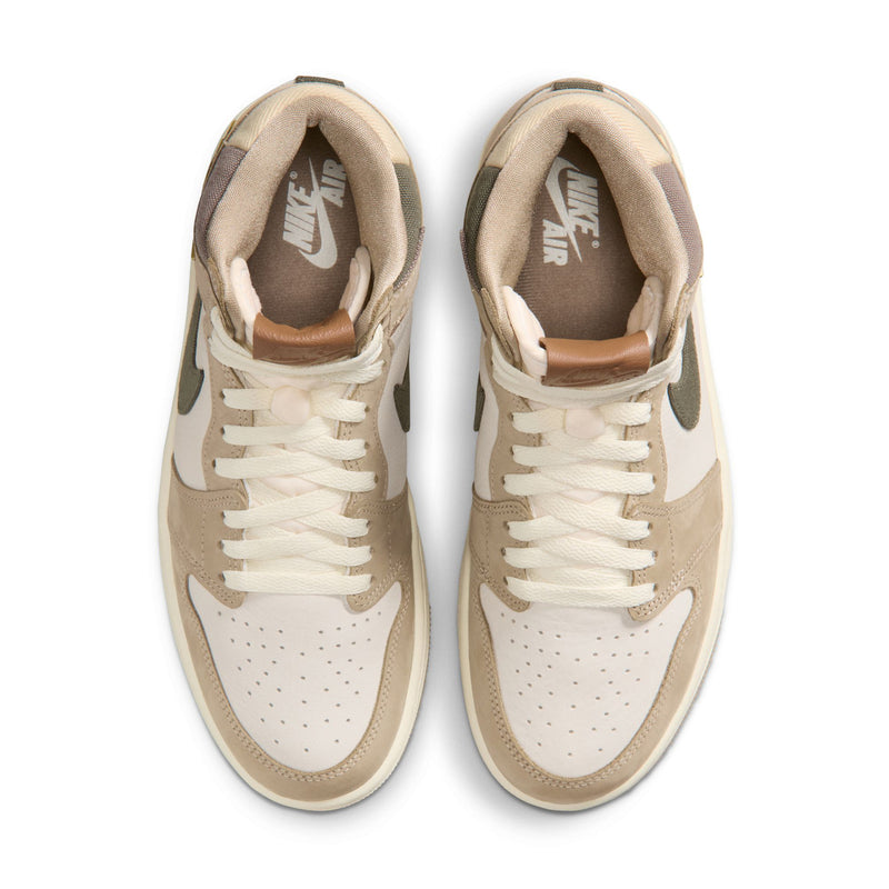 Front view of high-top sneakers with sail laces, perforated toe, and tan leather panels