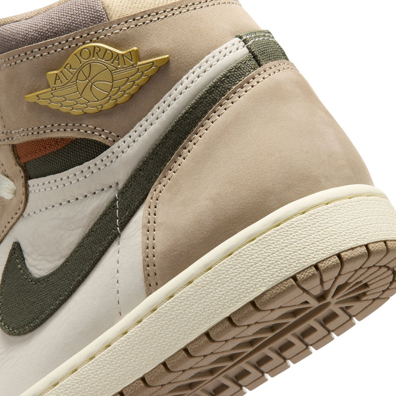 Close-up of high-top sneakers with gold Air Jordan wing logo and stitched midsole