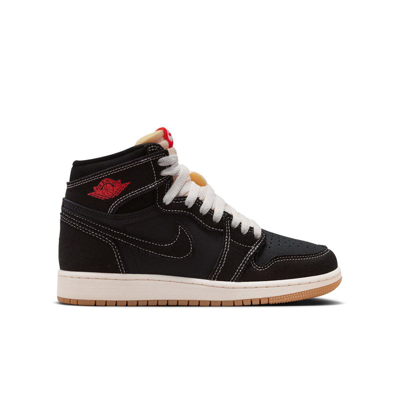 Black high-top youth sneakers with red Air Jordan wing logo, white laces, gum sole.