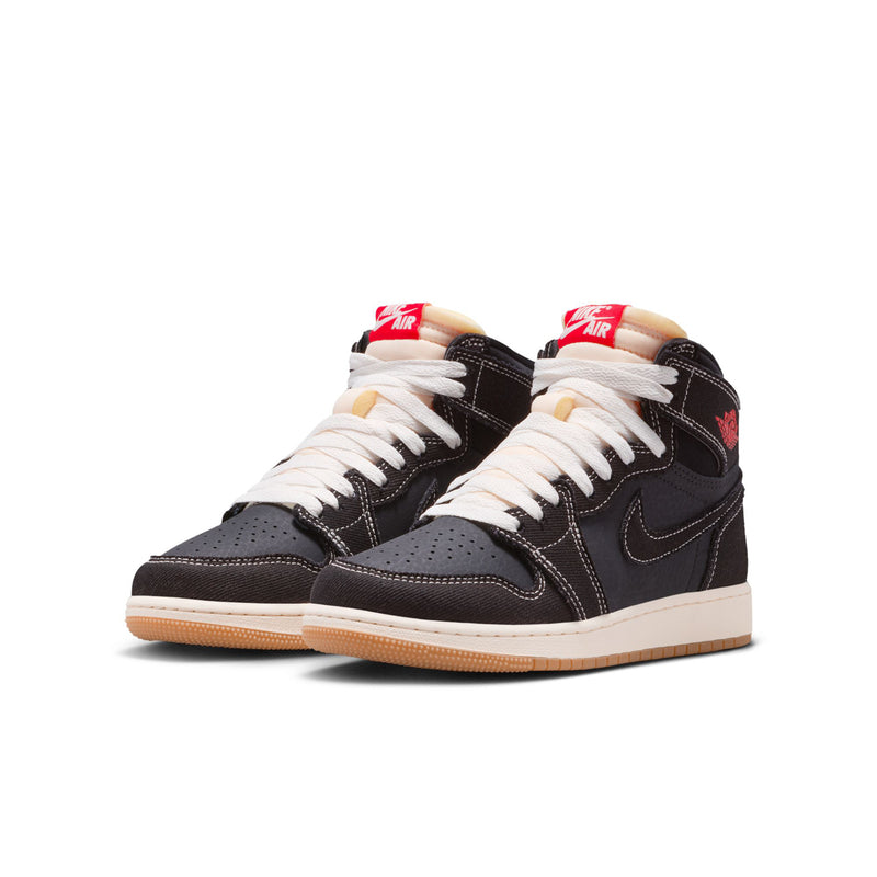 Pair of black youth high-top sneakers with white laces, red heel accents, gum sole.