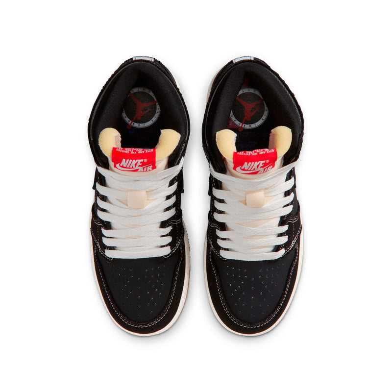Black youth high-top sneakers showing white laces and Nike Air tongue lining.