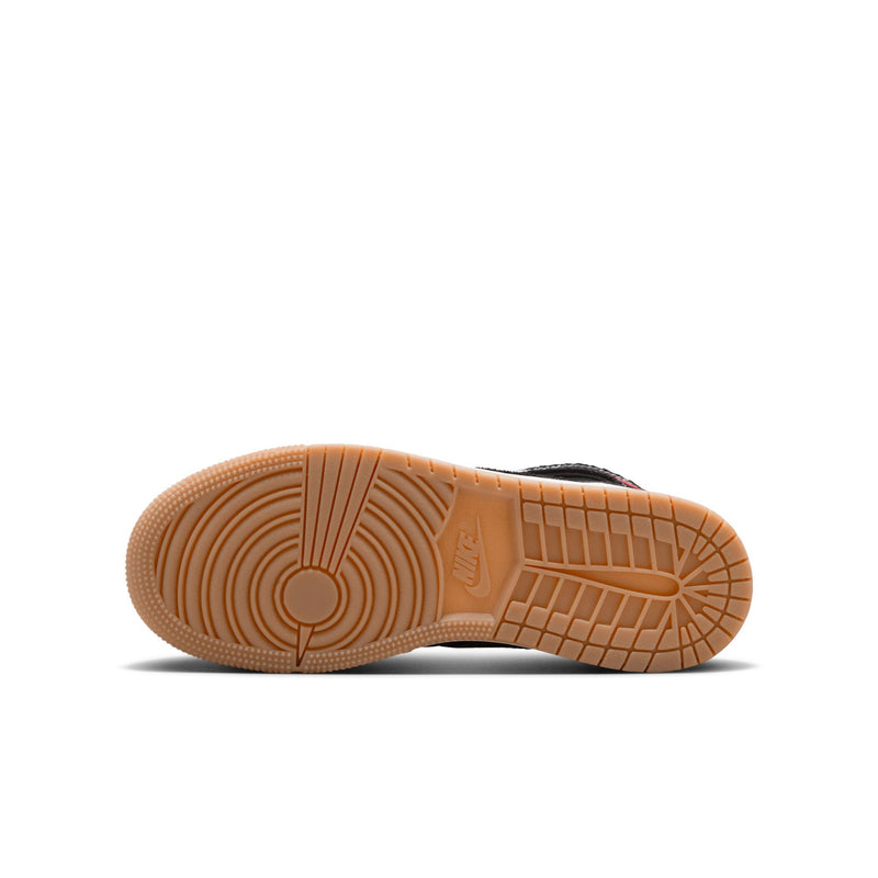 Gum rubber outsole for black youth high-top sneakers with circular traction pattern.