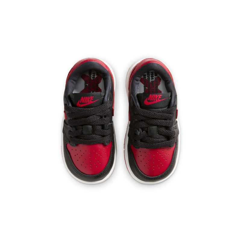 Toddler low-top sneakers with red-and-black insoles and Nike branding