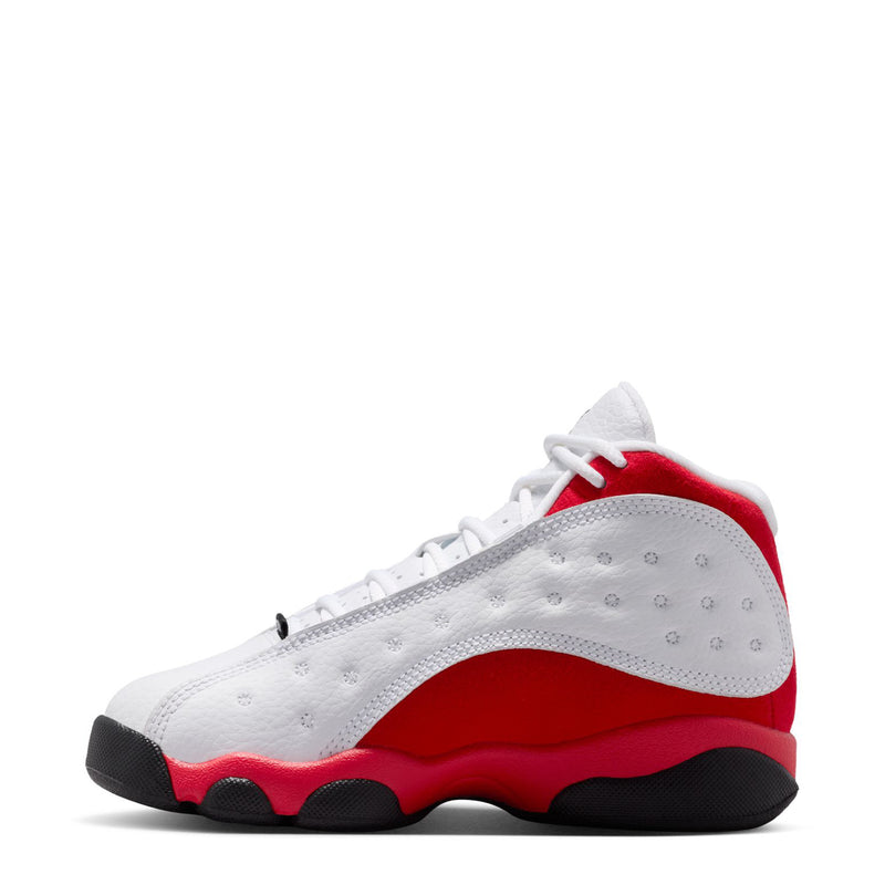 Kids' retro 13 sneakers, white upper with red collar and black toe bumper.