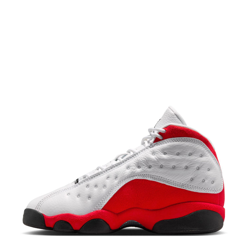 Youth high-top sneaker side view in white leather with red accent and black sole