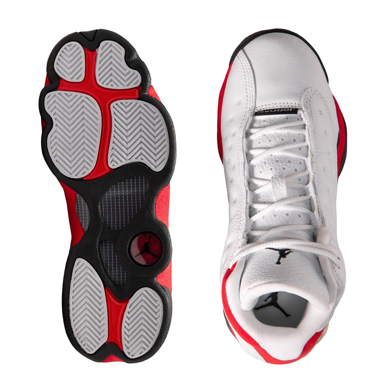 Youth sneakers shown: treaded outsole and lace-up upper with white, red, and black details