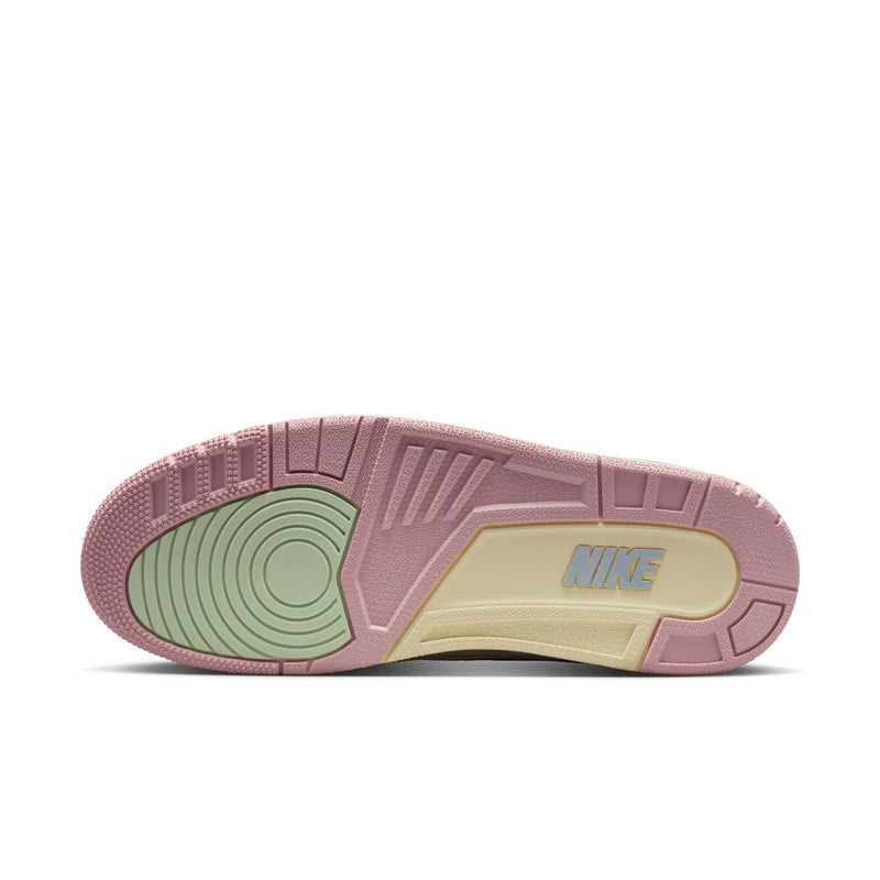 Men's retro basketball shoe outsole, pink tread with green center and Nike branding