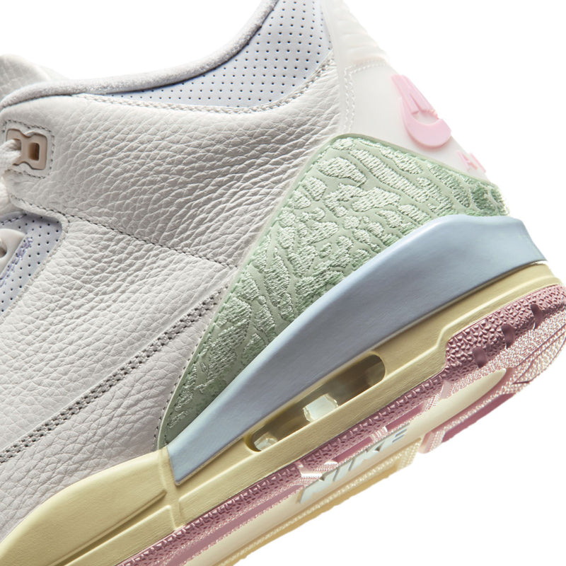 Men's retro basketball shoe side close-up, white leather with mint panel and air unit
