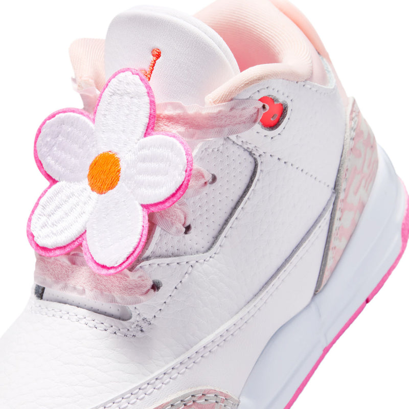Toddler Retro 3 sneaker in white and pink with flower lace charm.