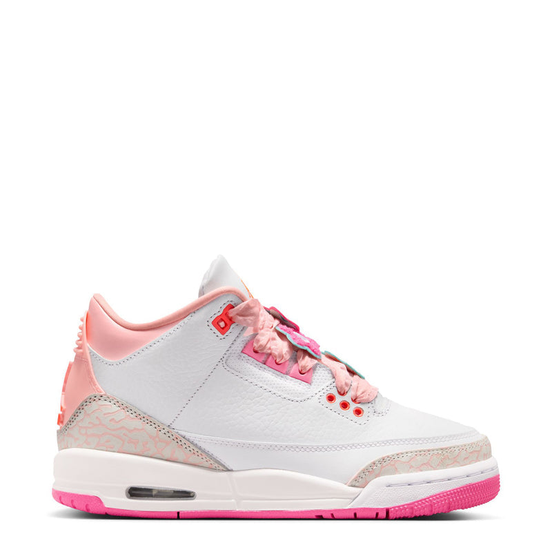 Youth sneaker with white upper, pink laces, colorful eyelets, and pink Air sole