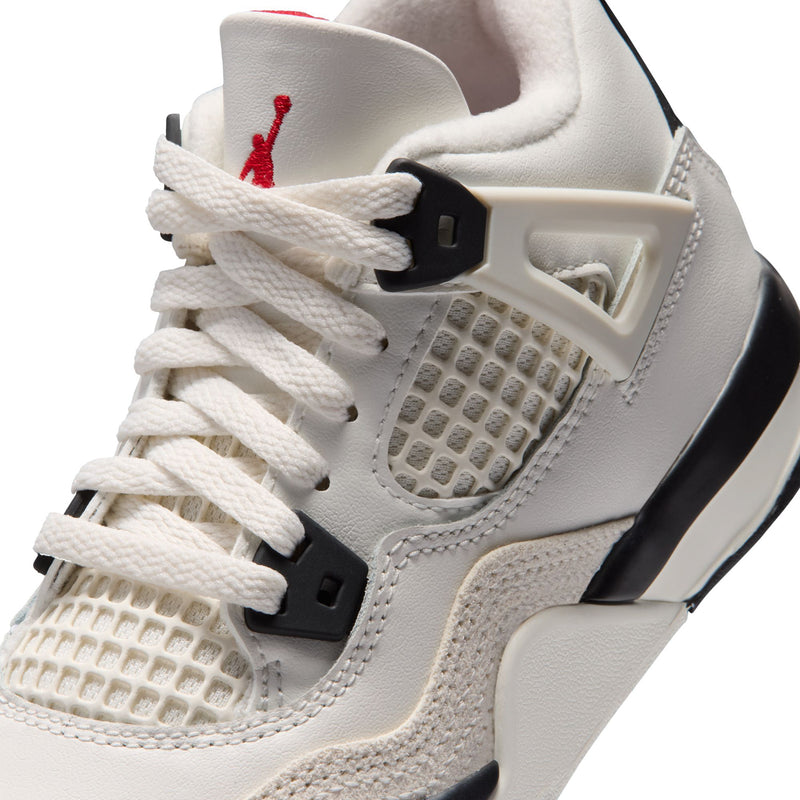 Kids white sneaker close-up with lace-up front and mesh quarter panel