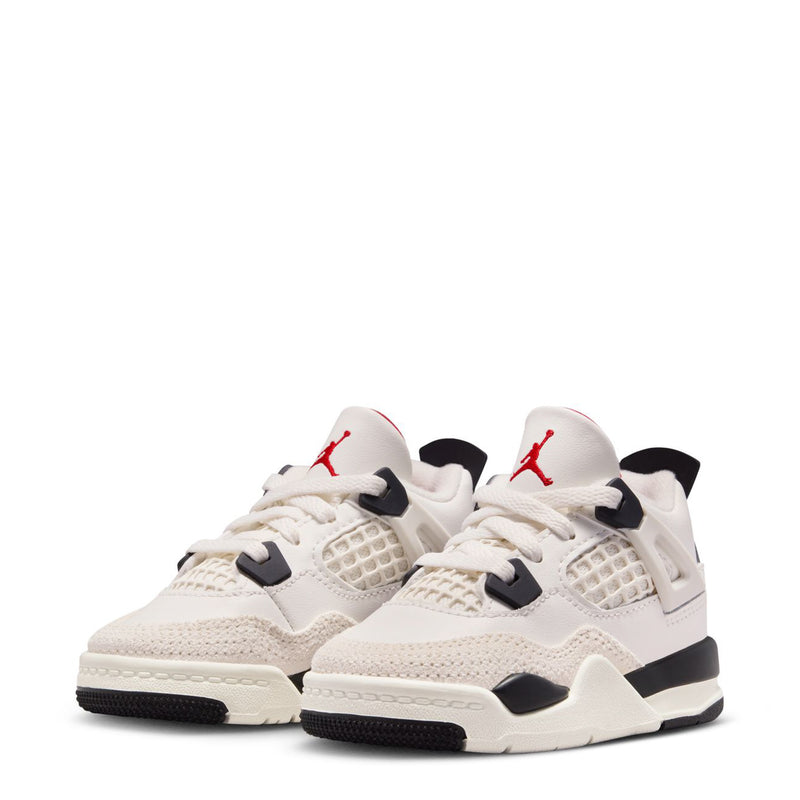 Pair of kids low-top sneakers with sail uppers, black accents, and red Jumpman on tongue