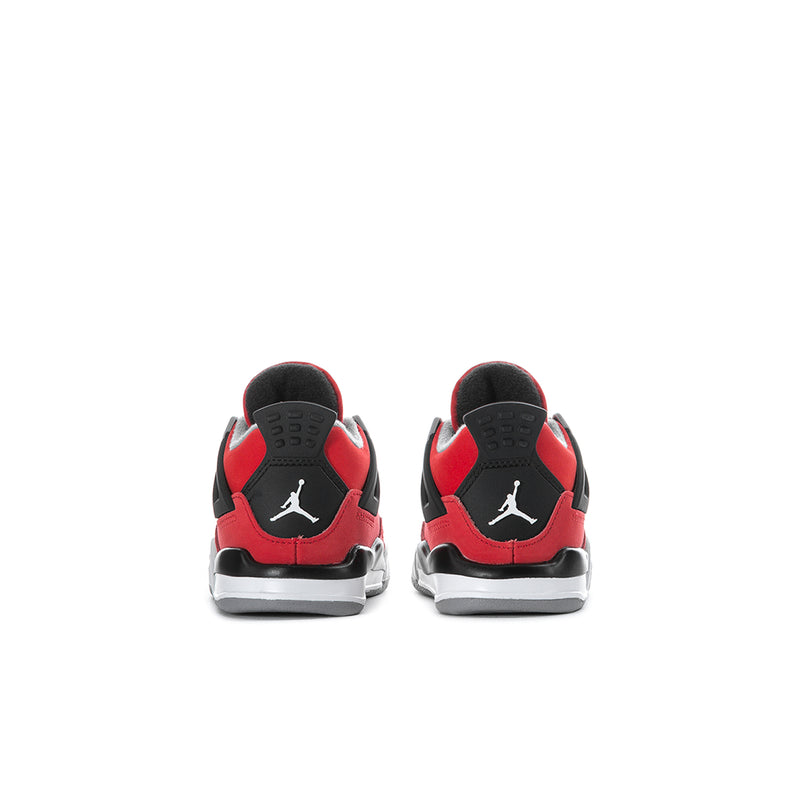 Toddler red low-top sneakers with black heel panels, white outsole, and Jumpman logo