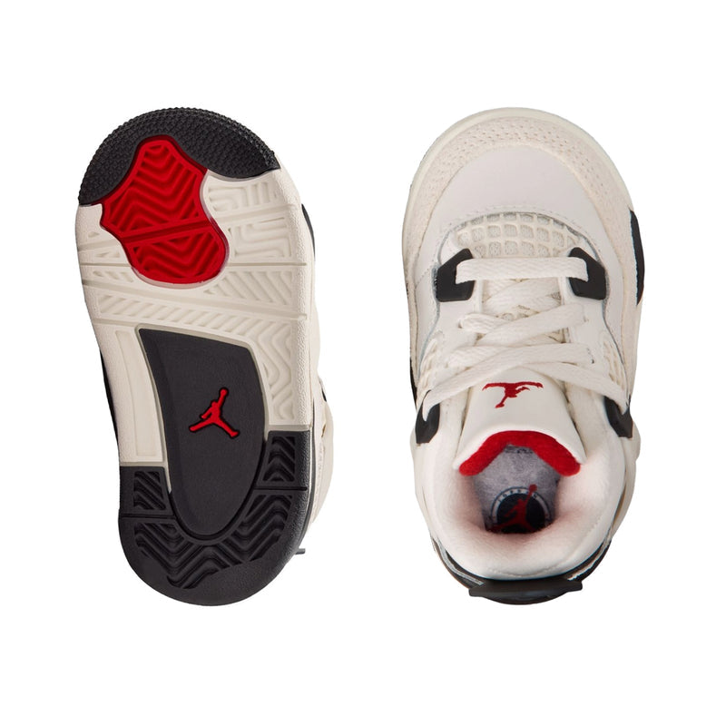 Kids sneaker outsoles with blue-gray tread and red Jumpman logo on heel