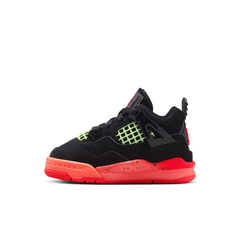 Toddler black sneakers with neon green grid and red sole, side profile