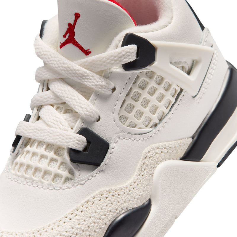 Close-up kids sneakers with lace, mesh panel, black straps, and red Jumpman on tongue