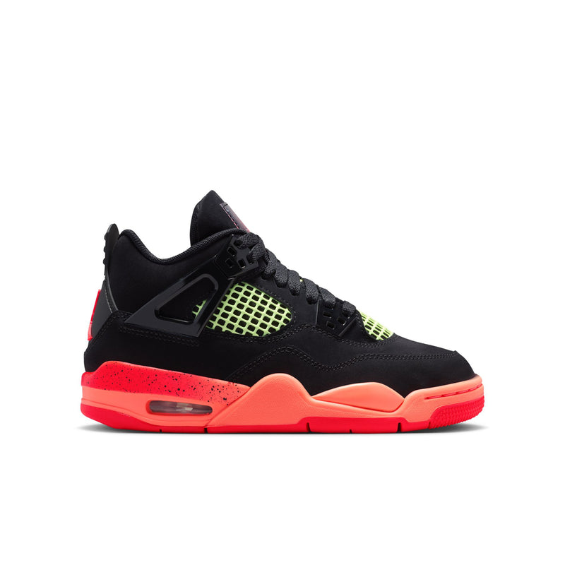 Youth black basketball sneaker with neon green mesh and red-orange midsole