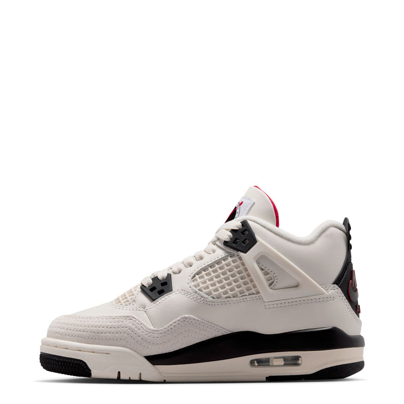 Youth sneaker side view in sail white with black midsole and red accents