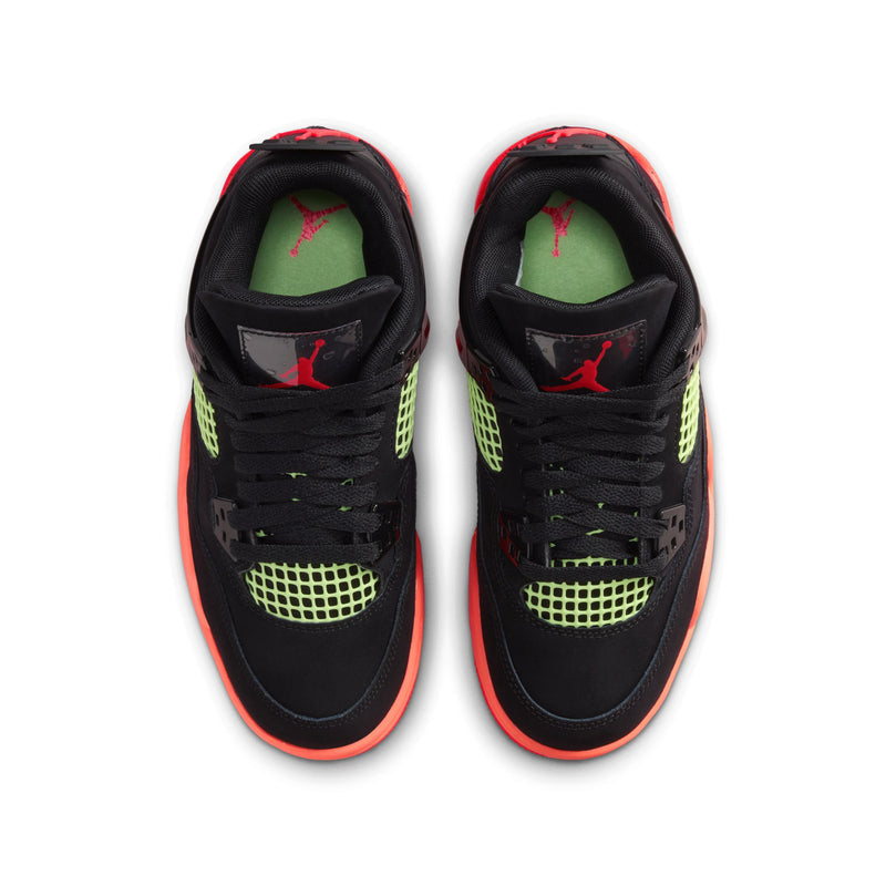 Pair of youth black sneakers with neon green uppers and red-orange accents