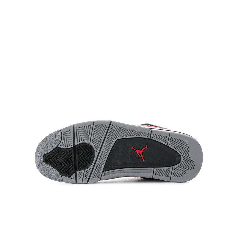 Youth sneaker outsole with herringbone tread and Jumpman logo on dark rubber