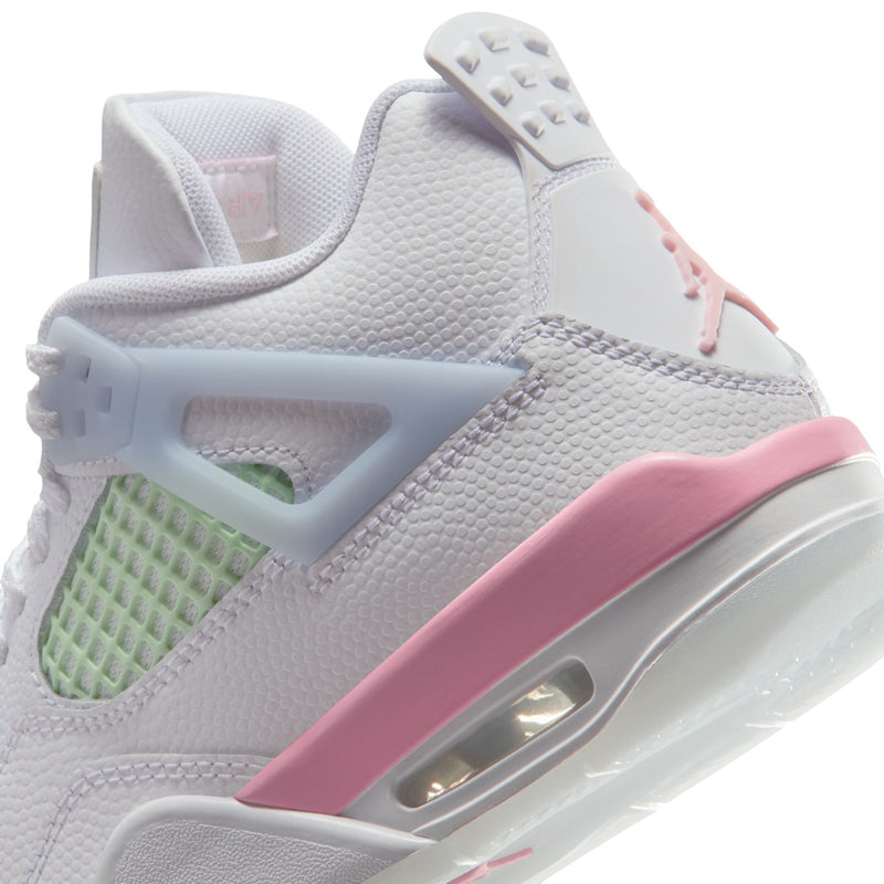 Close-up side of youth sneakers: white textured upper, pink midsole band, visible air unit window.