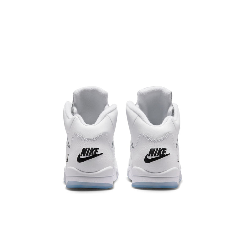 Kids white sneakers with black Nike heel logo and light blue sole