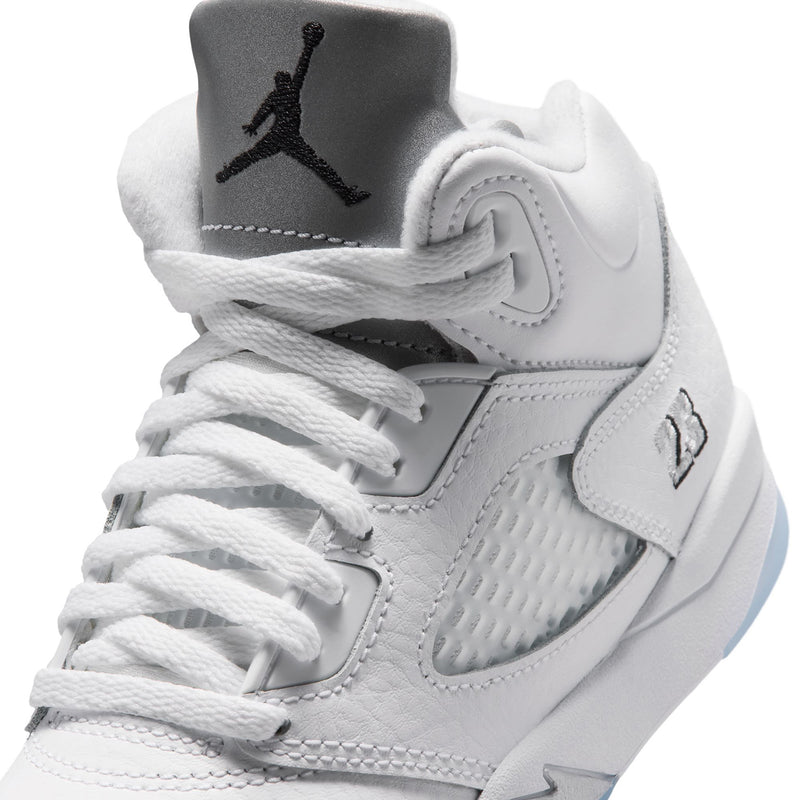 Kids white sneaker upper close-up with black Jumpman on collar and lace eyelets