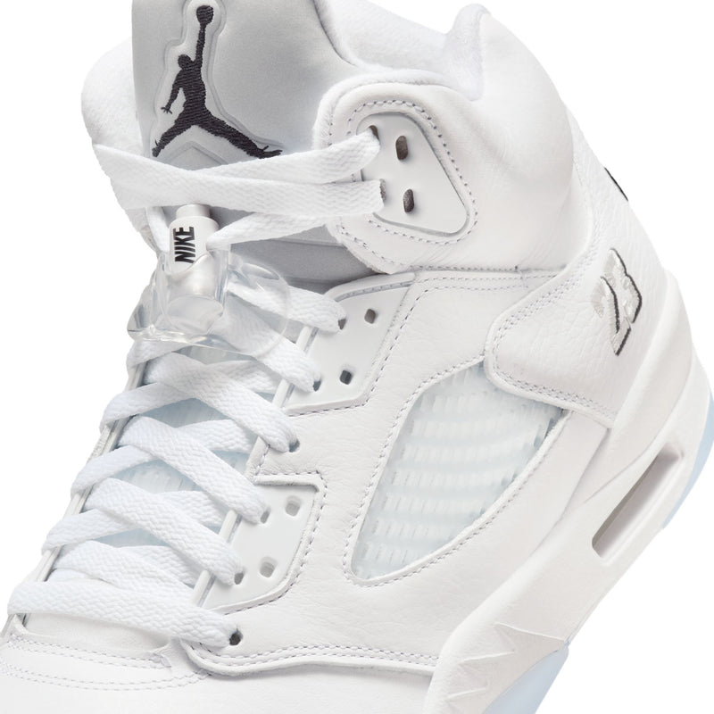 Men's Retro 5 close-up showing white laces, mesh panels, and black Jumpman logo on tongue