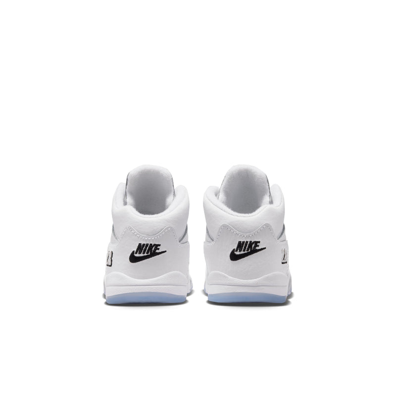 Toddler heel view with Nike text, black logo, and blue outsole on white high-top sneakers