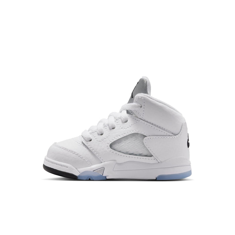 Toddler white high-top sneakers with black logo, white laces, and blue outsole edge