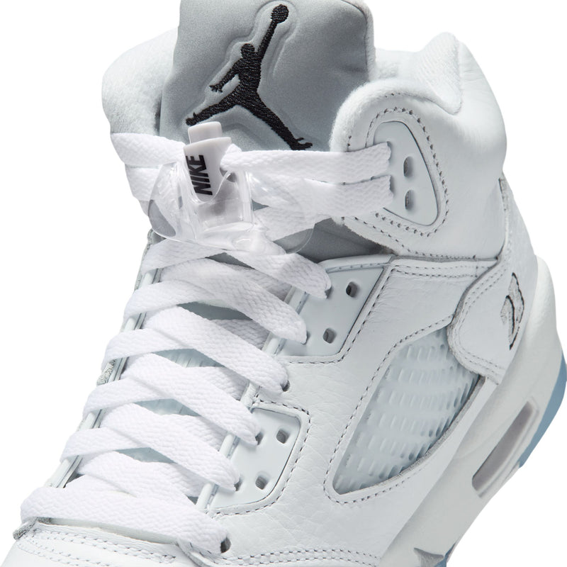 Youth sneaker upper close-up with white leather panels and laced forefoot