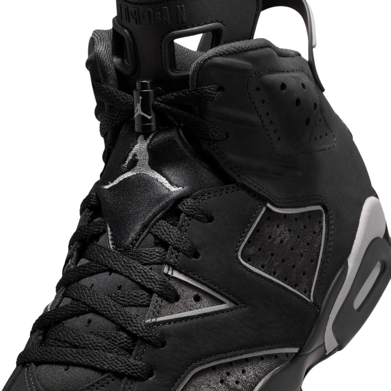 Men's black high-top sneakers, close-up of laces and lace eyelets with logo