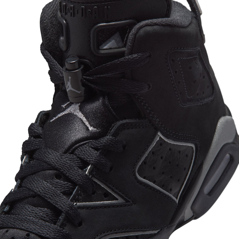 Youth black high-top sneakers, close-up of laces and side panel