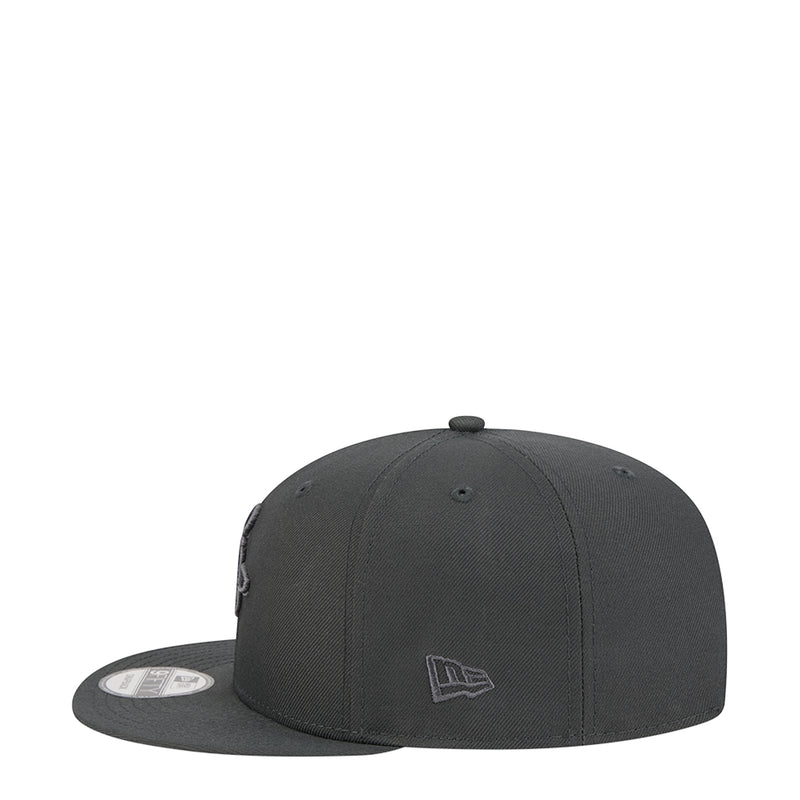 Dark gray Houston Rockets snapback cap with small embroidered logo on side panel