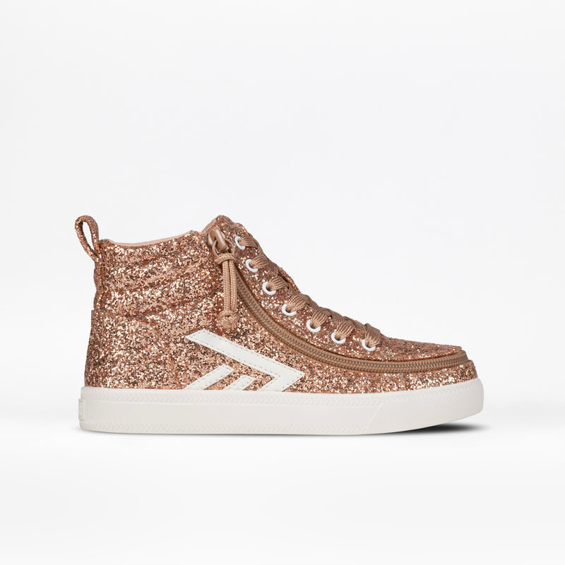 The Kids'/Toddler CS High by BILLY Footwear are rose gold glitter high top sneakers with white laces, a white side stripe, and a thick white sole, shown on a plain white background.