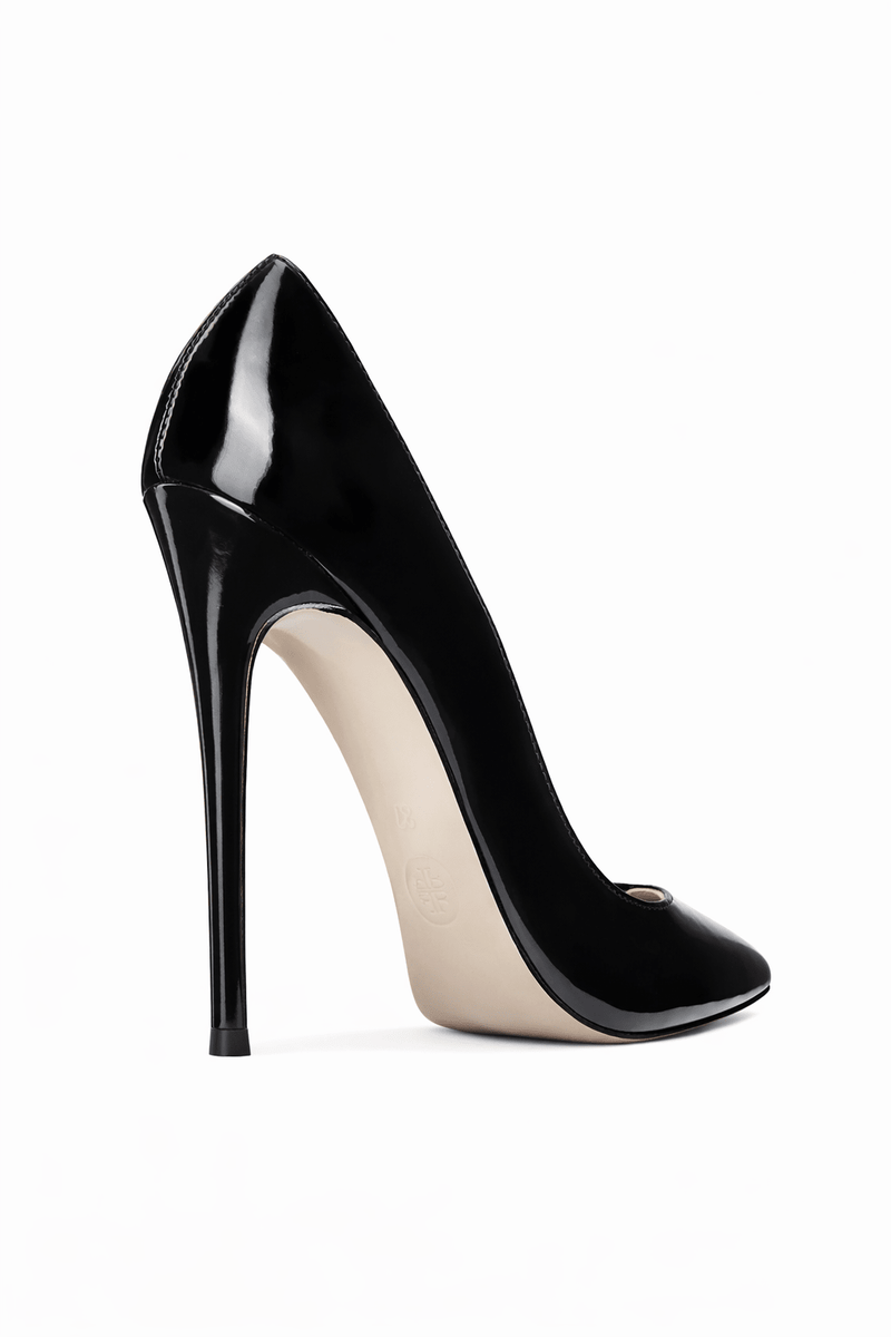 FEMME LA Rum Pump in black patent, 3/4 back angle showing slim stiletto heel and nude outsole