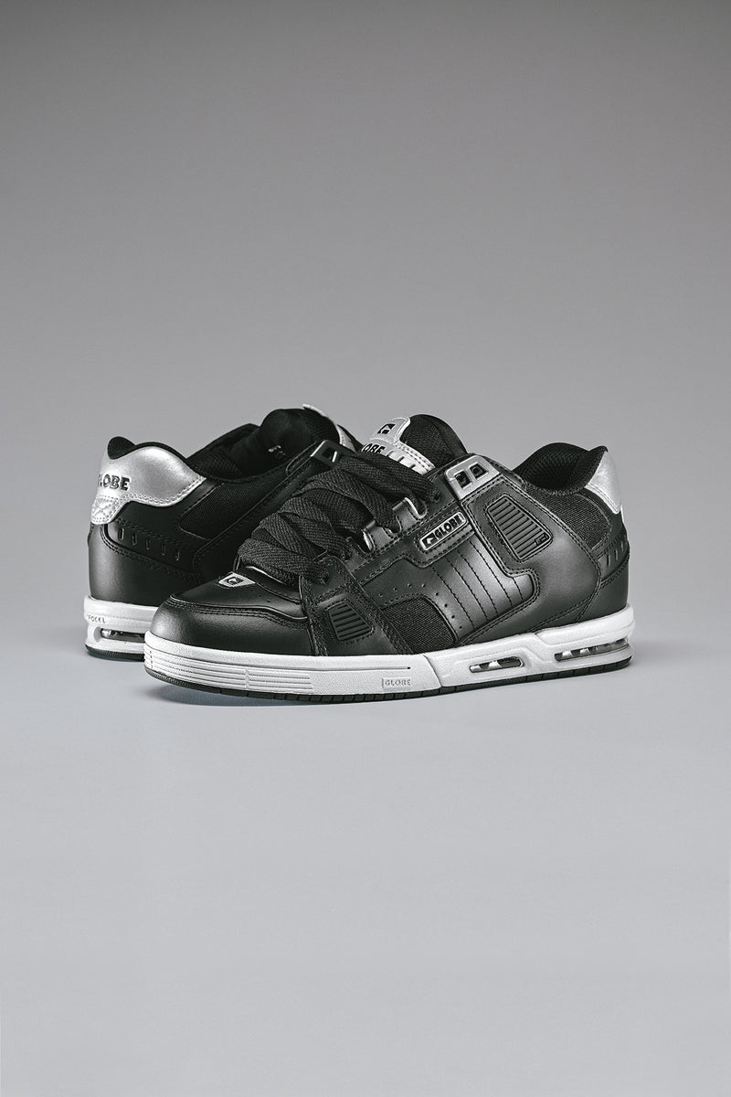 Sabre black and silver skate shoe with white sole and visible airbag unit, side view.