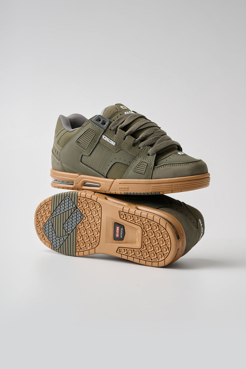 Side angle of Moss Globe Sabre skate shoe highlighting rugged upper and tan outsole