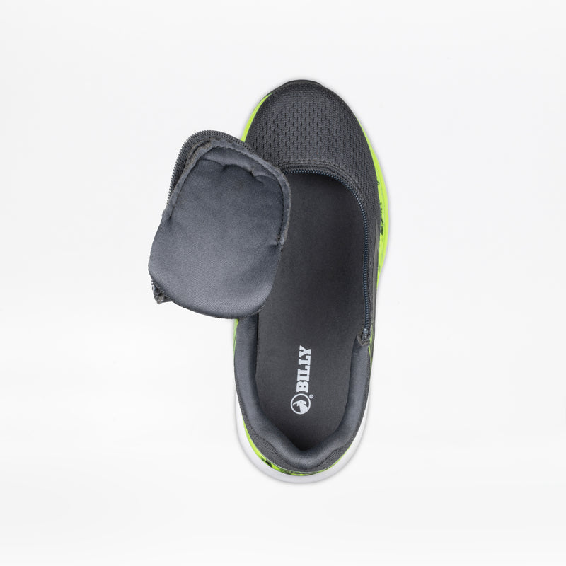 The SALE - Smoke/Lime Fire BILLY Sport Inclusion by BILLY Footwear is a dark gray kids’ slip-on sneaker with a soft, padded flap, neon green sole, and adaptive design. The insole is labeled BILLY. Shown on a white background.