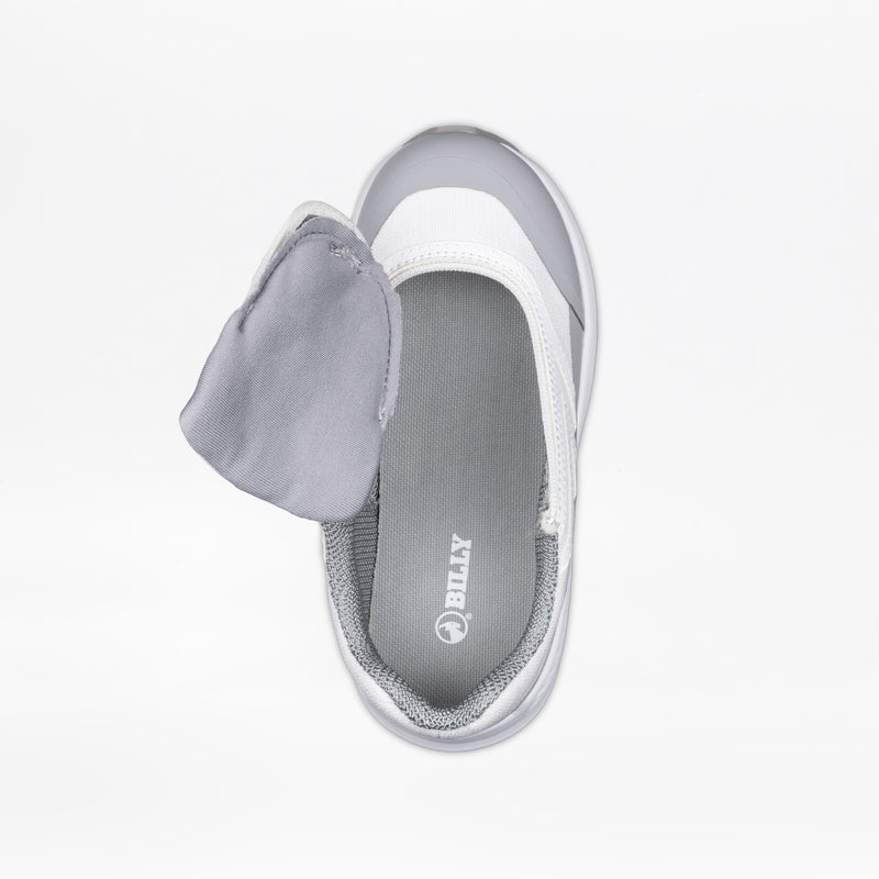 The SALE - White BILLY Goat by BILLY Footwear is shown from above with the white and gray upper partially peeled back, exposing a gray insole printed with the brand name. The background is white.