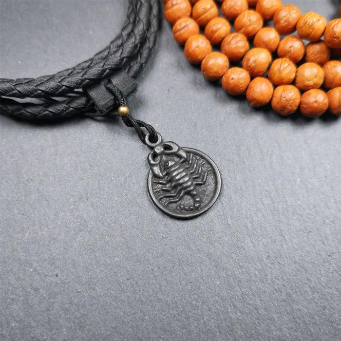Scorpion Guru Amulet 0.8" - Tibetan Buddhist amulet, front view