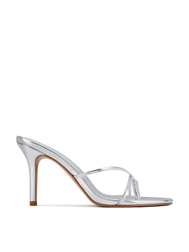 Femme LA Sicilian Slipper in Platinum – side profile showing silver metallic body and slim crossed straps on a slim stiletto heel
