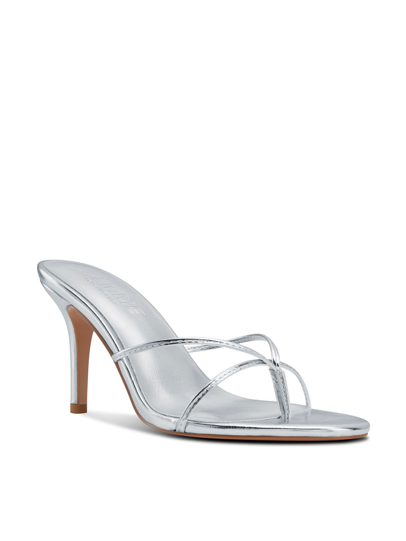 Femme LA Sicilian Slipper in Platinum – front three-quarter view showing silver metallic crossed straps and FEMME LOS ANGELES silver insole