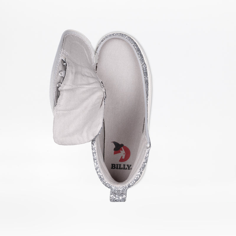 A silver glittery flat shoe viewed from above shows an unzipped upper with the BILLY logo on the insole—ideal for kids who love the sparkle and style of the Silver Glitz BILLY CS High by BILLY Footwear.
