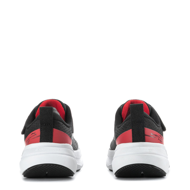 Kids black sneakers with red heel panel and white sole, back view