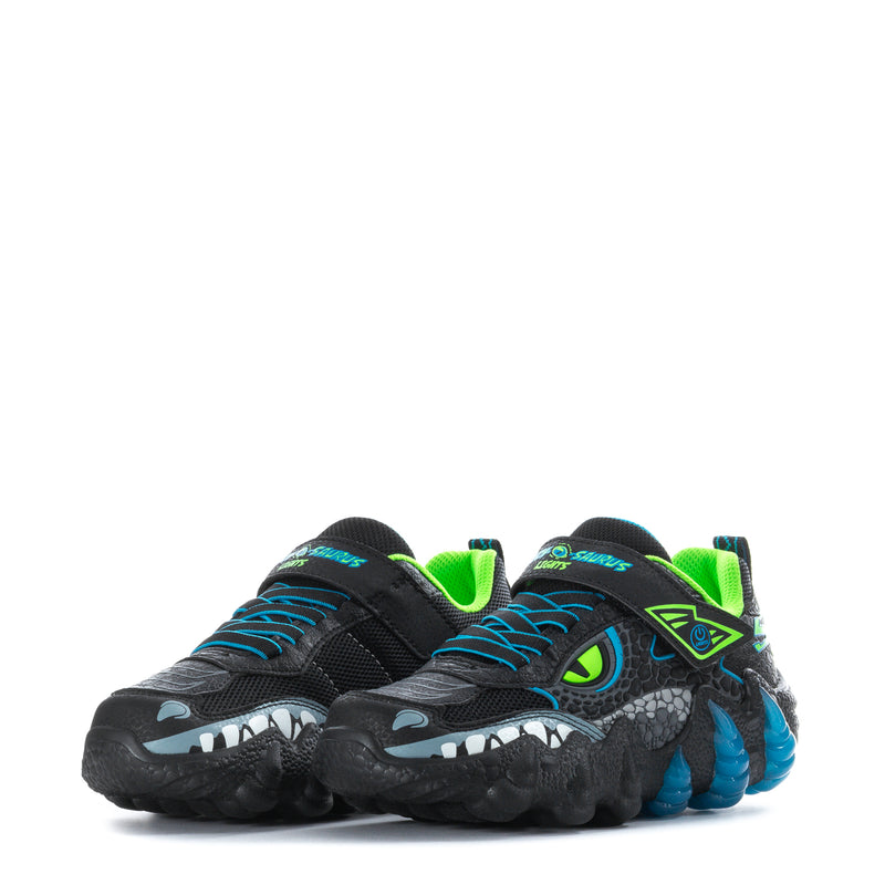Kids black sneaker pair, neon green lining with blue claw-tooth side print.