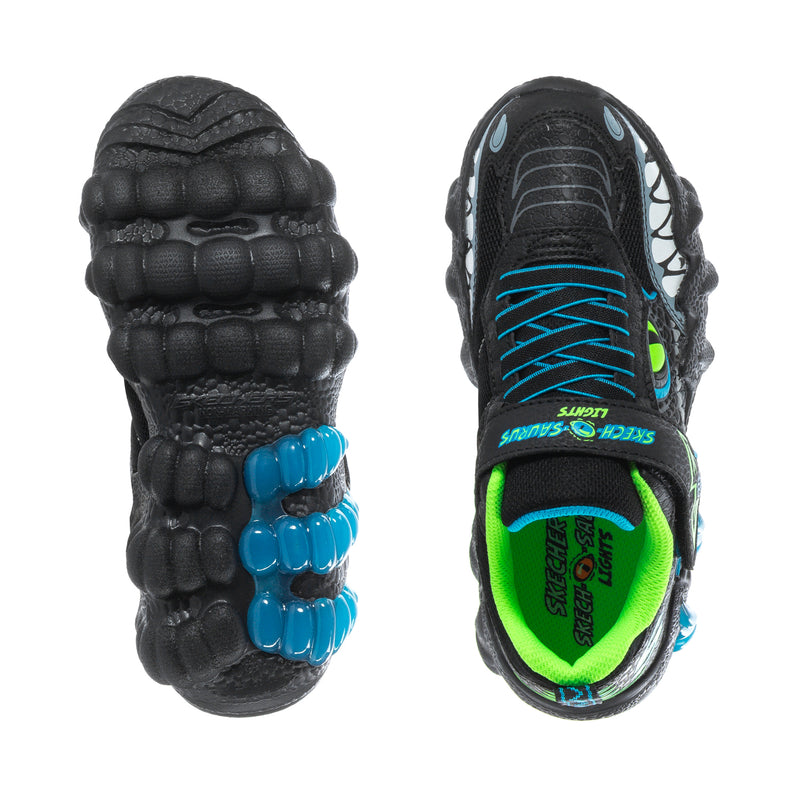 Kids sneaker soles view: black outsole with blue accents, neon green interior.