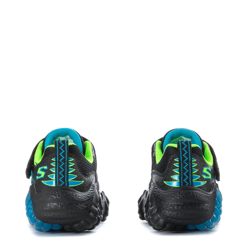 Kids black dinosaur-print sneakers, neon green and blue heel accents.