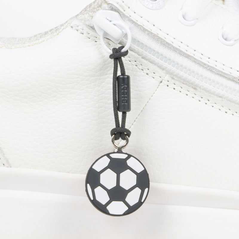 Black soccer ball zipper pull on a white shoe